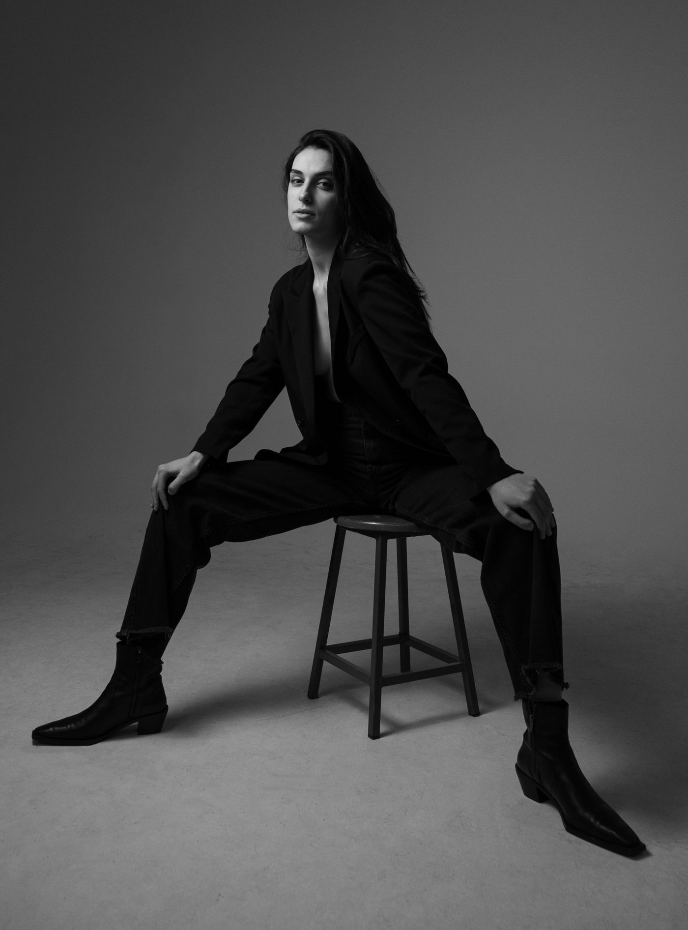 Ankle boots worn with dark trousers and a tailored jacket.