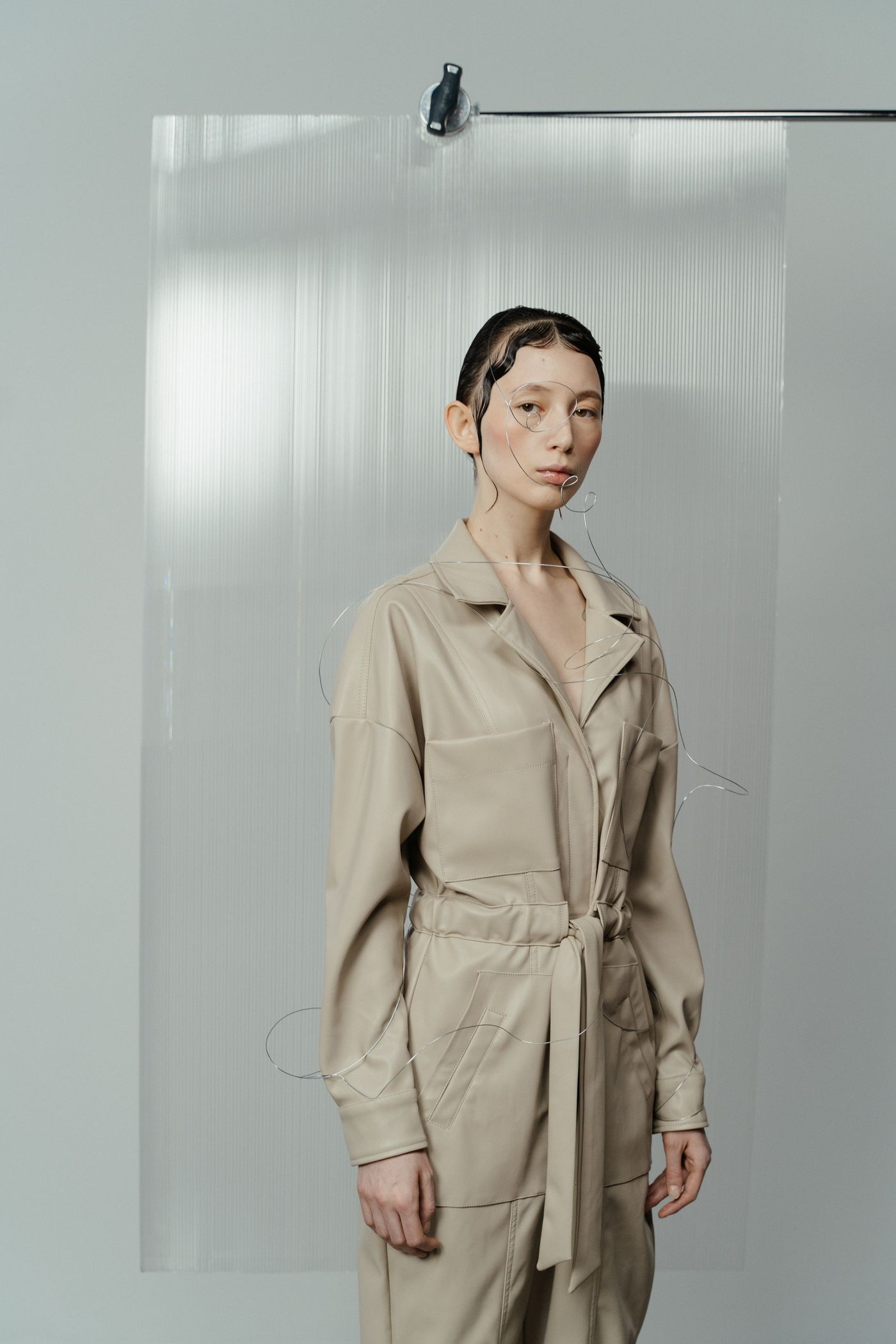 A woman wearing a beige all-neutral outfit.