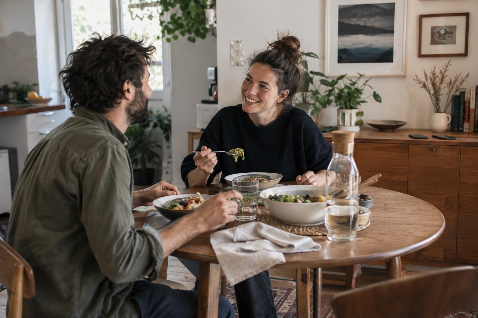 Two people sharing a meal and conversation without phones.