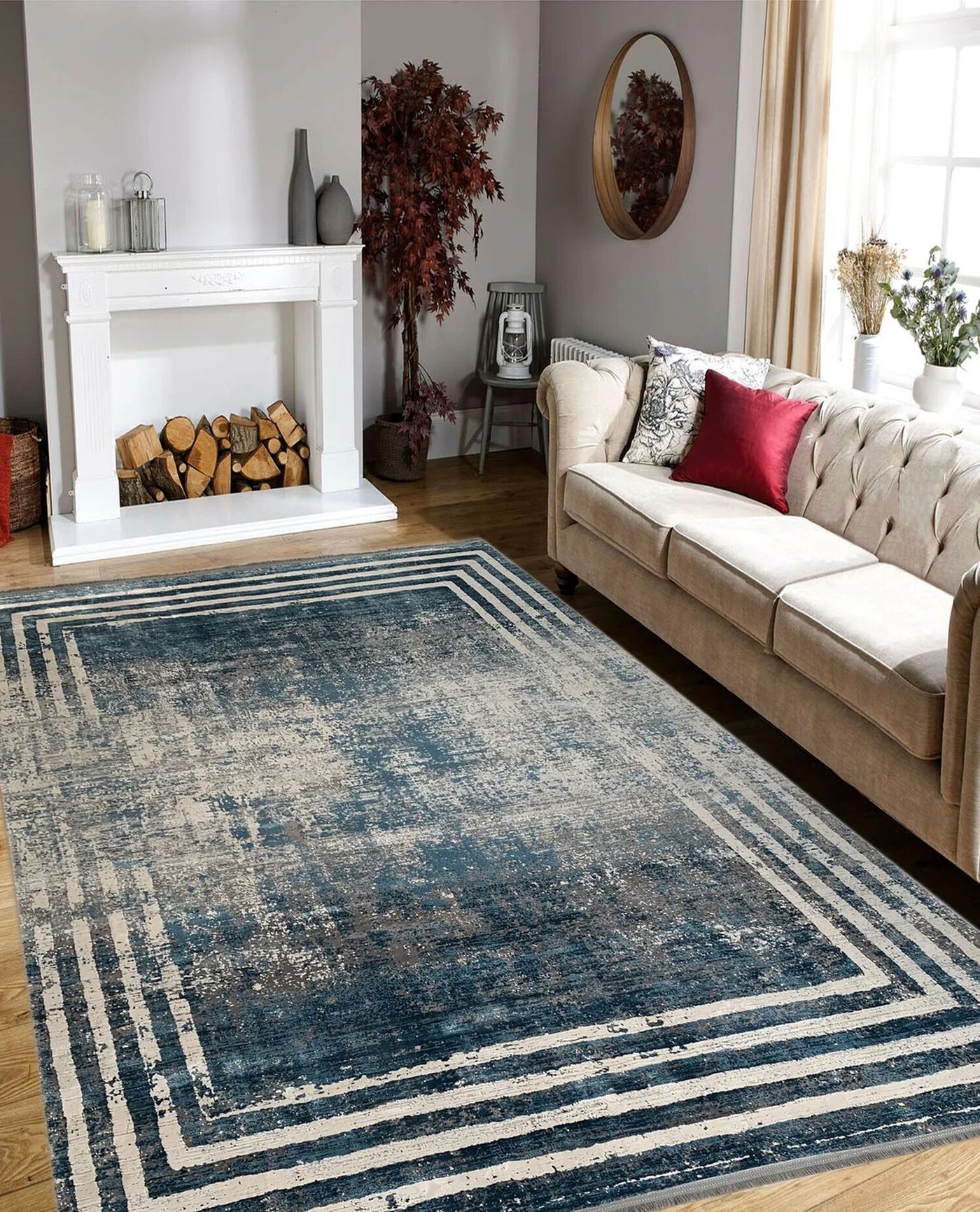 A large patterned rug positioned beside a living-room sofa.